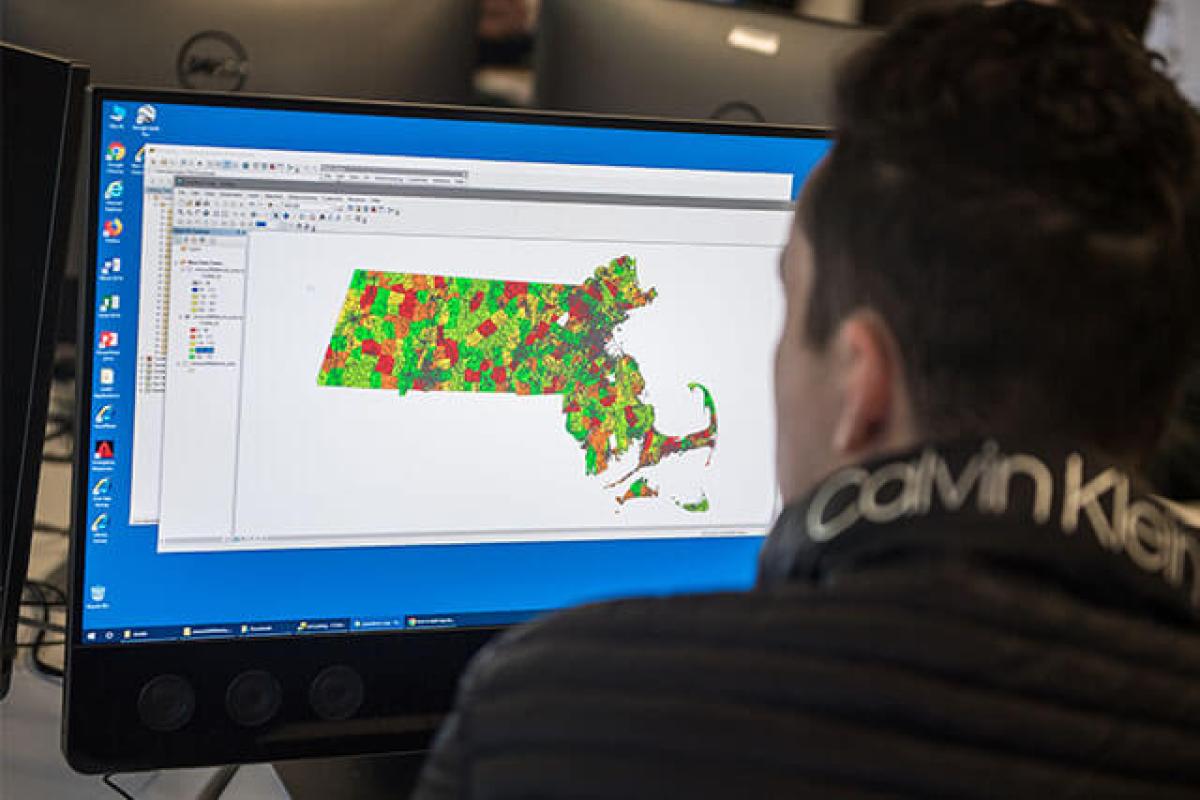 Student learning how to use digital surveyor map.