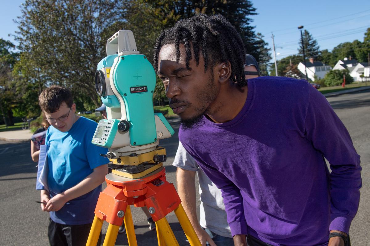 Westfield State Students survey a parking lot in town.