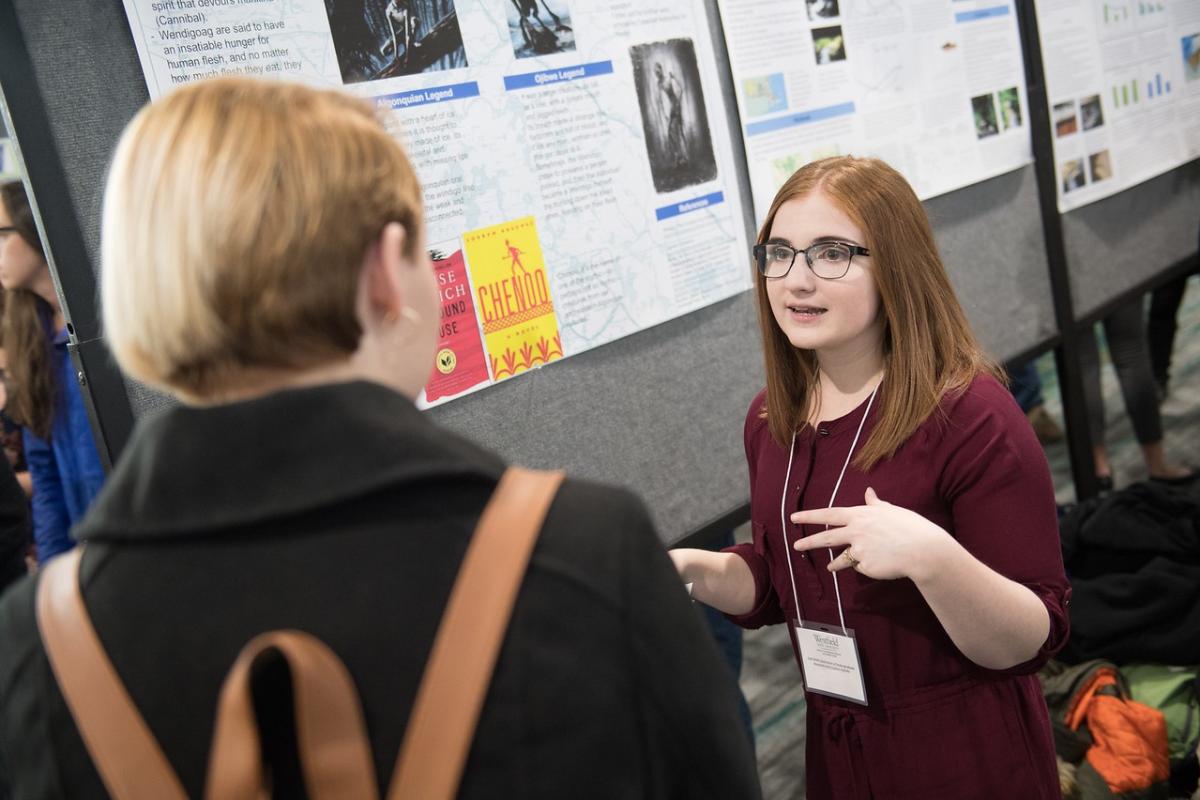 English student presenting undergraduate research.