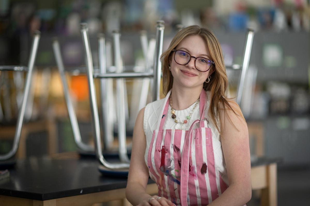 Art licensure student smiling at her internship with a high school.