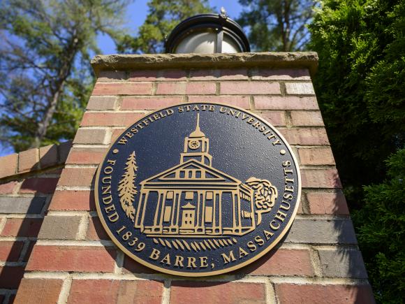 University seal on the main gate to campus