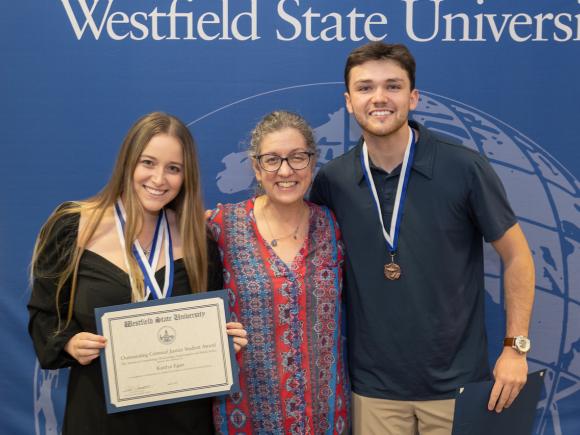 Academic Awards Ceremony including two Criminal Justice Honor's Program students and a faculty member.