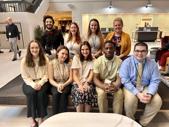 Honors Program group photo including students and a faculty member smiling in rows.