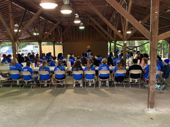 President Linda Thompson welcoming the new Honors students to campus. She is speaking to them at a pavilion in Stanley Park, Westfield.