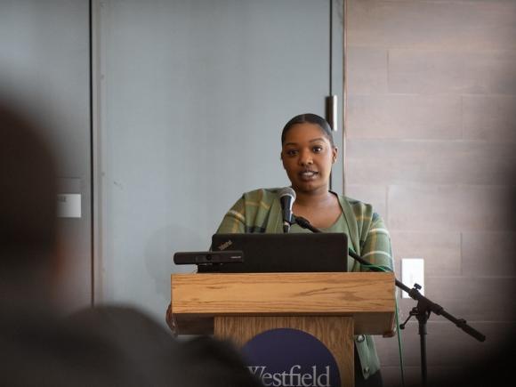 Speaker at podium at career exploration day for communications.