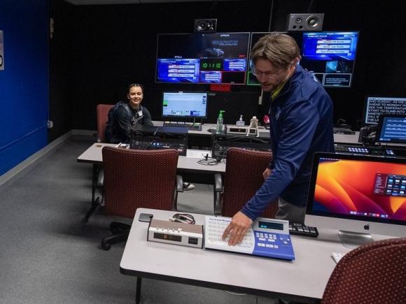 Career Exploration Day with staff member and student in TV studio.