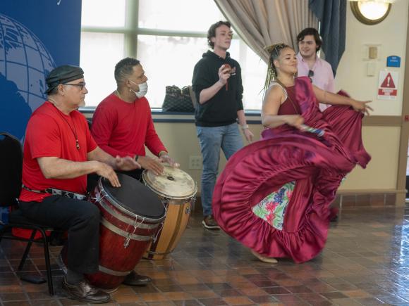 The SANKOFA Stolling ceremony featuring a dancer with two drummers.