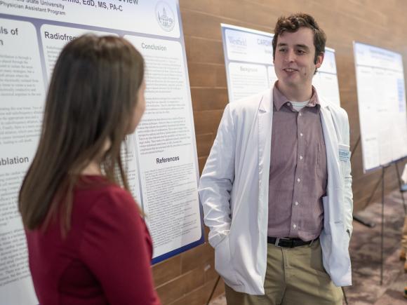 Physician assistant student presenting capstone research project.
