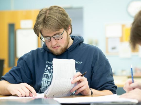 Math student assisting peers at the Math Tutoring Center.