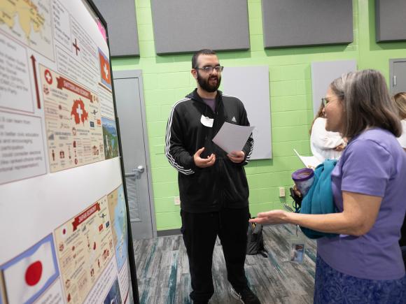 Political science student presenting research at the Undergraduate Research Conference.