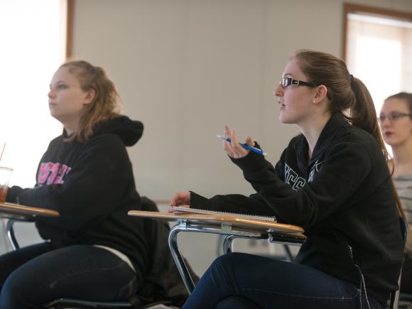 Students engaged in a classroom discussion.