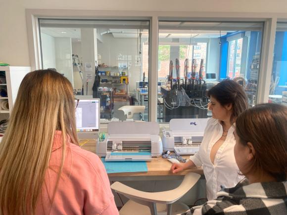 students working on cricut machine in RIDE Center