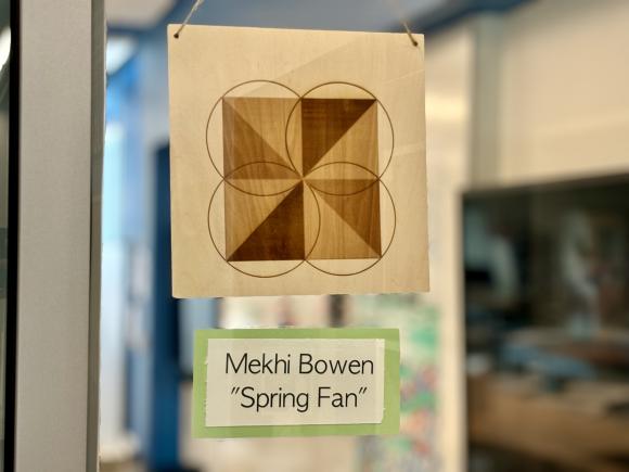 Geometrical pattern titled 'spring fan' created in a math explorations class.