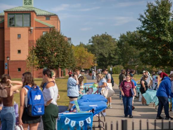 Crowd visits tables on Campus Green