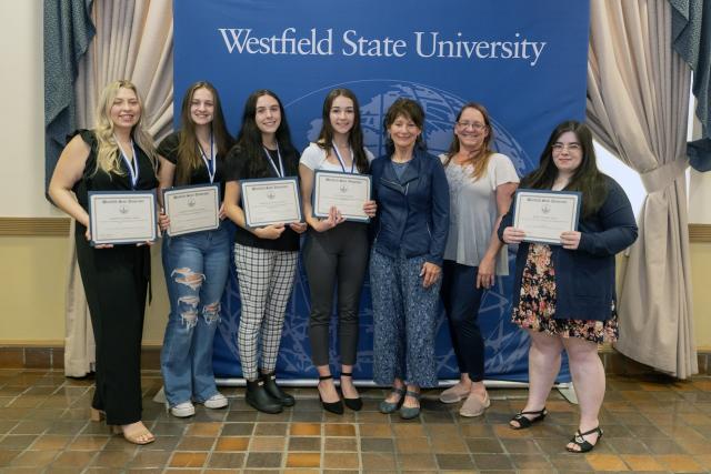 Psychology students with faculty member at Academic Awards Ceremony.