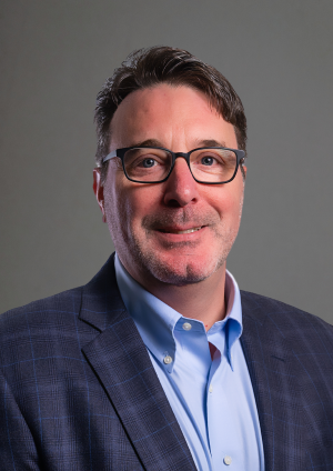 Headshot of Jay Queenin.