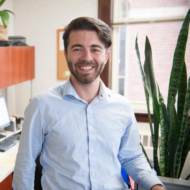 Student smiling at an internship. 