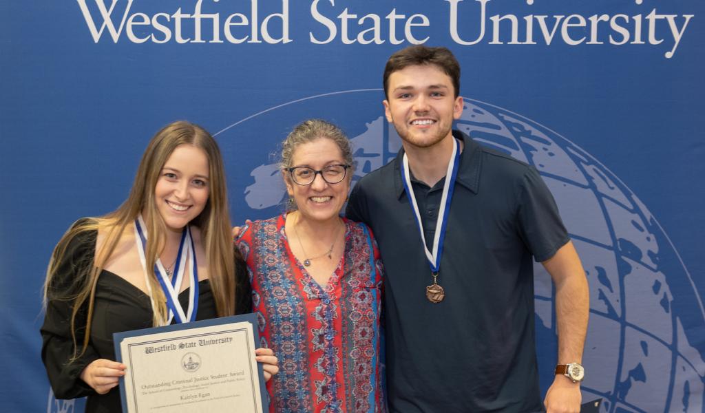 Academic Awards Ceremony including two Criminal Justice Honor's Program students and a faculty member.