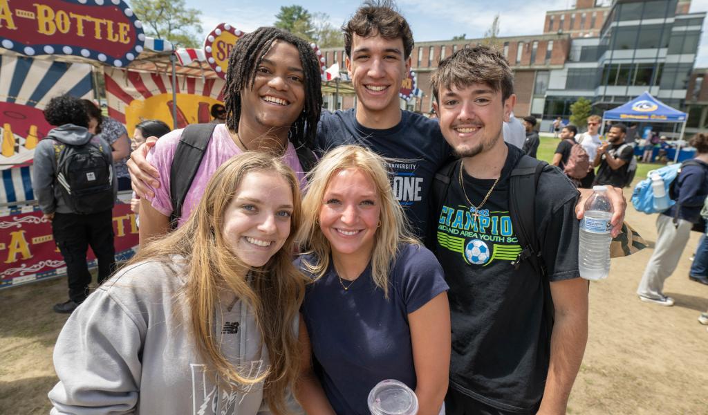 Group of students smiling together at Flight Fest event.