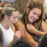 Two students smiling at New Student Orientation.